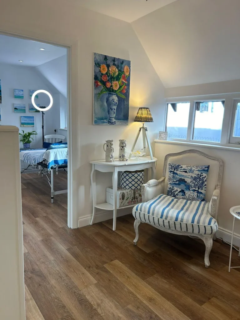Private consultation area inside Blue Bird Aesthetics in Worthing, with a comfortable chair and calm, professional décor.