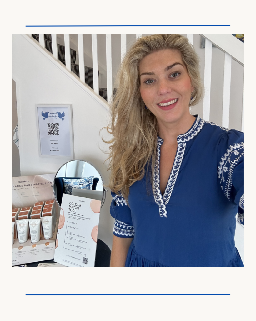 Dr Amber Halliday, aesthetic doctor at Blue Bird Aesthetics in Worthing, smiling in clinic setting