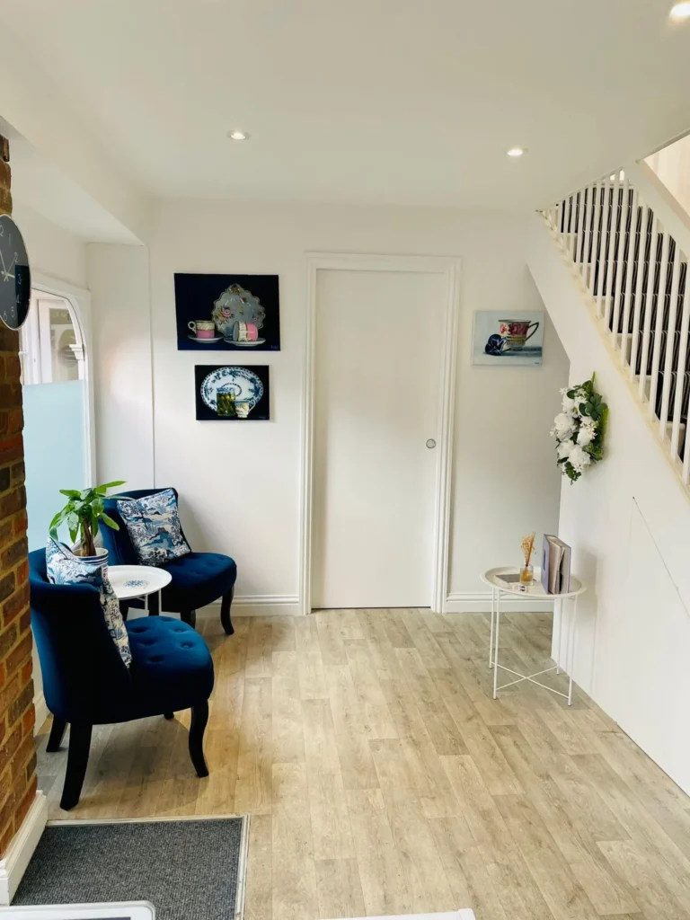 Downstairs reception area at Blue Bird Aesthetics in Worthing, featuring a calm, welcoming clinical space.