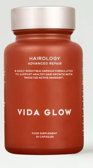 Vida Glow Hairology supplement bottle designed to support healthy hair growth.